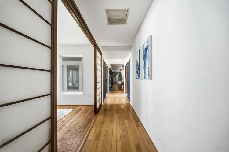 Hallway with wood-framed sliding screen panels